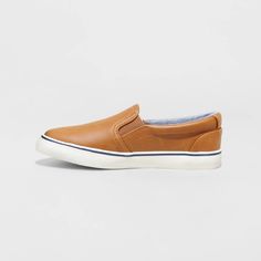 For comfortable outings, your kid will choose these Enzo Slip-On Sneakers from Cat & Jack™. These slip-on sneakers are designed with a soft upper and a fabric insole to provide their feet all-day comfort. Featuring a flocked outsole, these medium-width sneakers feature a round toe with a faux-leather upper in a solid hue and a contrasting midsole, making them a great pairing with a variety of their ensembles for smart styling. Cat & Jack™: Classics with an imagination of their own. Casual Brown Slip-on Sneakers With Ortholite Insole, Synthetic Slip-ons With Vulcanized Sole And Round Toe, Casual Brown Slip-on Sneakers, Brown Slip-on Sneakers For Sports, Casual Synthetic Slip-ons With Round Toe, Casual Slip-ons With Synthetic Material And Round Toe, Casual Slip-ons With Round Toe In Synthetic Material, Spring Brown Slip-on Sneakers With Rubber Sole, Casual Synthetic Canvas Shoes With Rubber Sole