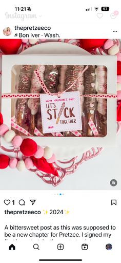 a box of chocolates with pink and white candies in it