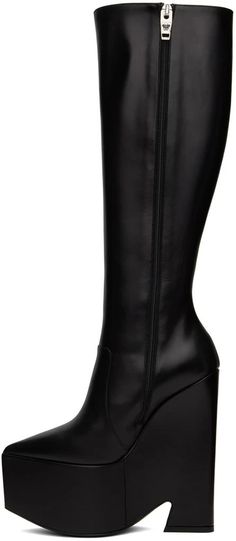 Versace.Black Tempest Platform Tall Boots.Knee-high buffed calfskin boots in black..· Pointed toe.· Zip closure at inner side.· Buffed leather lining.· Covered platform midsole.· Covered heel with rubber injection.· Medusa hardware at polished calfskin outsole.· Platform: H3 in.· Heel: H6 in.Supplier color: Black/Palladium.Calfskin..Made in Italy..231404F115004 Black Knee-high Platform Boots With Leather Lining, Black Knee-high Calf Leather Heeled Boots, Black Knee-high Heeled Boots With Leather Lining, Black Wide Calf Knee-high Boots With Leather Lining, Wide Calf Black Knee-high Boots With Leather Lining, Classic Black Calf Leather Platform Boots, Black High Shaft Boots With Reinforced Heel, Black High Shaft Boots For Work, Sleek Leather Boots With High Shaft