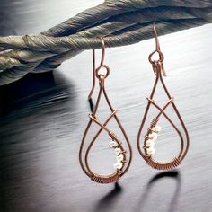 "Tiny pearls - small double teardrop solid copper earrings, dangling earrings, organic earrings, wire earrings with a dainty design. Hammered for strength and antiqued for a beautiful finish. A beautiful birthday gift and Mother's Day gift.  Gauge/Material: 19 gauge solid copper earrings, with 19 gauge solid copper ear wires, 2mm pearls. Finish: oxidized, tumbled and hand polished. Total Length is approximately 2\"  (5cm) Enter my Etsy shop http://ESTYsCREATIONs.com About the piece:  No two products will be exactly alike as they are made to order.  Please expect slight variation in size, shape and colour.  But that just adds to the hand made uniqueness and charm. This product is made from new materials but it might have some minor organic scratches/chips and minor notches from the hammerin Organic Earrings, Earrings Dangling, Earrings Wire, Beautiful Birthday, Dangling Earrings, Mother Pearl, Wire Earrings, Copper Earrings, Antique Copper