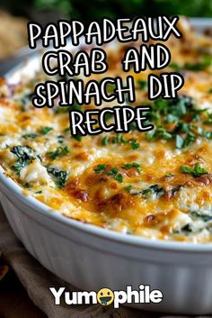 a casserole dish with cheese and spinach in it on a table next to bread