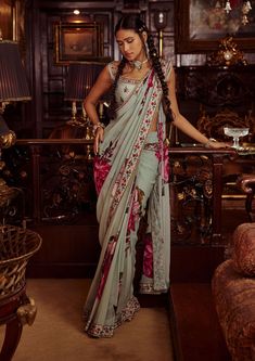 Editor's Note Featuring a pre-draped sari with elaborate overall floral prints. It is styled with a sleeveless blouse intricately embellished with beads and sequins. Fabric: Blouse: viscose sil... Western Blouses, Organza Sharara, Pant Saree, Ridhima Bhasin, Draped Saree, Ruffle Saree, Saree Gown, Drape Saree, Draped Skirt