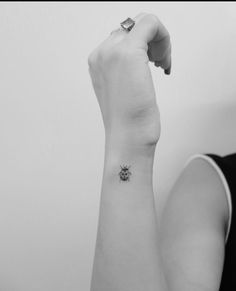 a woman with a small tattoo on her arm