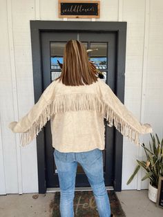 The Gage is a suede jacket with fringe back detailing. It has functional closure front buttons and two side pockets. Model is wearing size Medium. Spring Suede Outerwear With Fringe, Spring Suede Fringe Outerwear, Fall Leather Jacket With Tassels And Long Sleeves, Winter Leather Jacket With Tassels Long Sleeve, Winter Leather Jacket With Tassels, Back Details, Suede Jacket, Size Medium, How To Wear