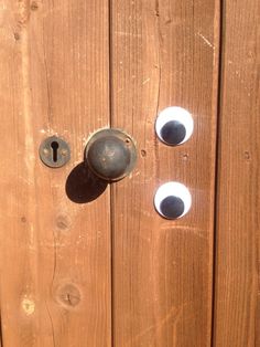 the door is made of wood and has two knobs