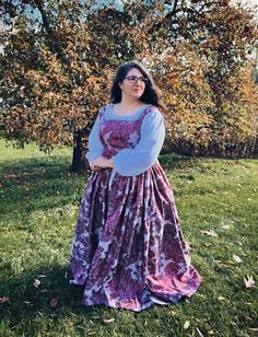 This listing is for one ready to ship silver and burgundy brocade renaissance dress ensemble with a white chemise shirt, size large.  This absolutely gorgeous dress includes a modesty panel for tailored sizing, a small 5 inch train, as well as pockets!   Measurements: Chest circumference: 40 inches  Waist circumference: 31 inches  Length: 57 inches  Created by me in my smoke/pet free studio Overdress dry clean only  Chemise shirt prewashed and washer/dryer safe Complimentary domestic shipping Elegant Dresses With Historical Design For Larp, Elegant Historical Design Dress For Larp, Fitted Purple Medieval Dress, Shirt Under Dress, White Chemise, Trendy Christmas Outfits, Modesty Panel, Dress Christmas, Under Dress