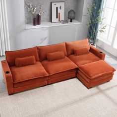 an orange sectional sofa in a living room