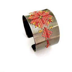 * A cross stitched embroidery metal cuff bracelet available in three colors: silver, gold or gray.  * A Grecian chic unique piece of jewelry. * Statement jewelry combine well with casual outfits. * Η παράδοση της σταυροβελονιάς συναντά το κόσμημα σε ολόκληρη τη σειρά «kentima».  * Το βραχιόλι είναι διαθέσιμο σε τρία χρώματα: επάργυρο, επίχρυσο και γκρι (επιροδιωμένο). * Ένα statement κομμάτι για τη συλλογή σας που συνδυάζεται ιδανικά και με το πιο απλό ντύσιμο. Elegant Festive Tilla Cuff Bracelet, Cross Stitch Patterns Bracelet, Gold Embroidered Bangle Bracelet, Bohemian Handwoven Cuff Bracelet For Gift, Bohemian Embroidered Cuff Bracelet For Gift, Metal Cuff Bracelet, Jewelry Statement, Stitch Embroidery, Statement Jewelry