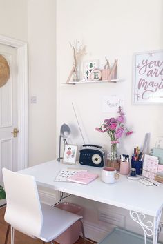 a white desk and chair in a room