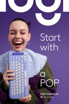 a woman holding a giant keyboard in front of her face with the words go on it