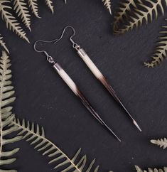 Add a touch of natural beauty to your look with these stunning porcupine quill earrings.  Each quill is carefully harvested and cleaned, then arranged in a delicate pattern to create a unique and eye-catching piece.  The lightweight design ensures all-day comfort, so you can wear these earrings with confidence. Your item will arrive in a beautiful packaged in a gift box, perfect for giving to a friend, or just to keep it for yourself! Pair these earrings with this beautiful necklace for a comple Porcupine Quill Earrings Native Americans, Porcupine Quill Jewelry Naturebeads, Native American Feather Earrings, Porcupine Quill Earrings, Quill Earrings, Real Feather Earrings, Porcupine Quills, Cowgirl Jewelry, Natural Jewelry