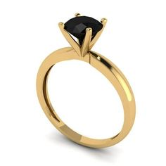 a yellow gold engagement ring with a black diamond