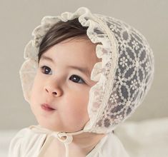 Product Details: The color is ivory not true white. Two sizes now!! Small fits newborn to 5m Medium fits 6-15m Soft nylon/cotton material. Hair accessories are not meant to be used as toys and should always be used under the adult supervision. Cute White Baptism Hat, White Adjustable Lace Bonnet, White Lace Adjustable Bonnet, Adjustable Lace Wedding Bonnet, White Adjustable Bonnet For Wedding, White Adjustable Wedding Bonnet, Adjustable Cream Bonnet For Baptism, White Adjustable Hat For Baptism, Adjustable Cream Bonnet As Gift