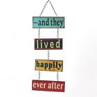 a cross stitch sign hanging from the side of a building that says and they lived happily ever after