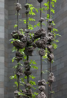 a sculpture made out of rocks and plants