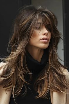 Woman with tousled brown hair and black turtleneck looking away thoughtfully. Womens Rocker Hair, Long Layered Haircuts For Fine Hair, Long Choppy Haircuts, Long Layered Haircuts With Bangs, Balyage Long Hair, Choppy Haircuts, Haircuts For Long Hair With Layers, Choppy Layers, Stylish Haircuts