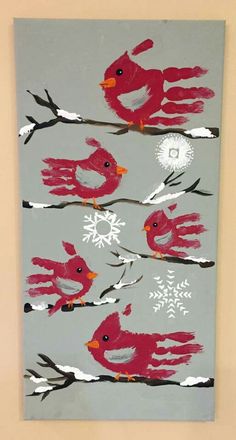 a painting with red birds and snowflakes on it