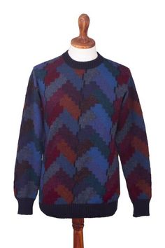 Colorful geometric motifs evoke stair steps in this handsome and combinable sweater for men. By Maria Cutipa the long-sleeved pullover features a neat crew neck cuffs and waistband in solid navy blue. She works in luxurious Andean alpaca renowned for its lightweight warmth. Luxury Alpaca Sweater, Winter Crew Neck Sweater With Geometric Pattern, Multicolor Long Sleeve Sweater With Geometric Pattern, Multicolor Alpaca Winter Sweater, Winter Geometric Pattern Crew Neck Sweater, Long Sleeve Alpaca Knit Sweater, Multicolor Geometric Pattern Long Sleeve Sweater, Hand-knitted Alpaca Cozy Sweater, 100% Peruvian Alpaca Sweater Women