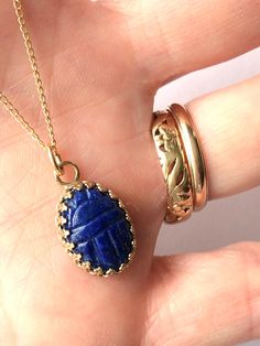 Yellow Gold Lapis Lazuli Cabochon Jewelry, Gold Oval Lapis Lazuli Jewelry, Oval Gold Lapis Lazuli Jewelry, Elegant Lapis Lazuli Jewelry For Healing, Artisan Gold Lapis Lazuli Jewelry, Artisan Gold Jewelry With Lapis Lazuli, Gold Lapis Lazuli Jewelry With Cabochon, Elegant Lapis Lazuli Oval Pendant Jewelry, Gold Lapis Lazuli Cabochon Jewelry