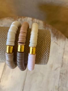 Set of 3 ~ High Quality Heishi Bead stretch bracelets! This 6mm bracelets features a gold bar, can do a solid color or color block with two colors! Fun and Flirty, Boho/ chic vibes. Can be stacked for a on trend fun look! Mix and match colors! can order a 6.5 , 7 or 7.5 inch bracelet~ let me know in the notes your size! Etsy only gives the option to choose 2 colors - you CAN choose different color combinations for each bracelet Please tell me in the notes section your color combinations for brac Adjustable Stacked Heishi Beads Stretch Bracelet, Everyday Stackable Heishi Beads Stretch Bracelet, Casual Gold Heishi Beads Stretch Bracelet, Gold Stacked Heishi Beads Jewelry, Adjustable Stackable Jewelry With Heishi Beads, Gold Stacked Heishi Beads Stretch Bracelet, Bead Stretch Bracelets, Bracelet Business, Vinyl Disc