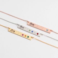 "Minimal and delicate personalized Swarovski birthstone bar necklace with mom (m♡m) engraved on it - the perfect Mother's day gift idea! D E T A I L S - A custom Swarovski birthstone bar with 'mom' stamped on it - All personalization is done BY HAND.  - Our Bar: a gorgeous hand brushed finish - Bar size: 5mm x 35mm - This listing is for one necklace - Each piece or set comes in a charming gift bag, ready for gifting. - Mom on the left and Birthstones on the right (birthstones will be placed from left to right to read) How To Order 1) Select your Quantity 2) Select your Color/ Length (more info on the length below) 3) Select your Number of Birthstone 4) Tell us your \"Birth Month you choose, in the \"Personalization\" box. 5)  Add to cart, and tell us if you have any specific instruction ne Dainty Engraved Birthstone Necklace For Mother's Day, Mother's Day Gift Bar Necklace, Personalized Minimalist Birthstone Necklace For Mom, Engraved Birthstone Necklace For Birthday And Mother's Day, Engraved Nameplate Birthstone Necklace For Mother's Day, Engraved Birthstone Necklace For Mother's Day Birthday, Minimalist Bar Necklace For Mother's Day Personalized Gift, Custom Name Birthstone Necklace For Mother's Day, Mother's Day Engraved Birthstone Necklace