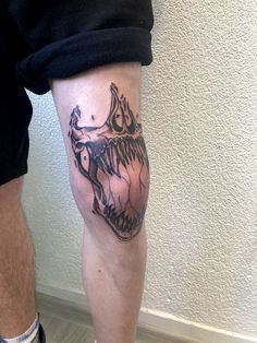 a man with a tattoo on his leg