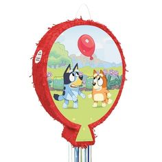 a red balloon with two cartoon dogs on it