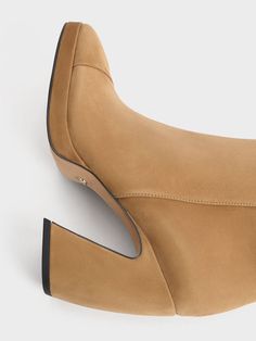 The rich caramel finish of these Jyll ankle boots exudes both warmth and comfort, perfect for the fall and winter months. They feature sculptural heels that add an artful flair to the otherwise simple design. With side zippers ensuring effortless wear, these boots are easy to slip on and off. Those with a keen eye for detail will also appreciate the subtle L�initial logo adorning the lining of the boots. Sculptural Heels, L Initial, Belt Ring, Initial Logo, Initials Logo, Charles Keith, Kids Sale, Winter Months, Heeled Ankle Boots