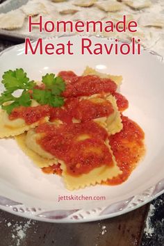 homemade meat ravioli on a white plate with parsley