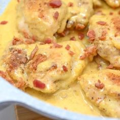 chicken with cheese and bacon in a white casserole dish