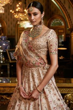 This set features an ivory raw silk lehenga set with silk thread embroidery highlighted with sequins and cut-dana, styled with a fully embroidered choli and embroidered tulle dupatta. Color: Ivory ... Dolly J, Silk Bridal Lehenga, Indian Lengha, Silk Thread Embroidery, Sister Of The Groom, Raw Silk Lehenga, Wedding Wardrobe, Anarkali Lehenga, Model Shoot