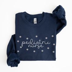 Floral Pediatric Nurse Sweatshirt, Peds Nurse Sweatshirts, Pediatric Sweatershirt, Picu Nurse Sweater, PEDS Nurse Shirt, Gifts for Nurses ABOUT: ⋒ The sweatshirt used is the Gildan 18000 Unisex Heavy Blend™ Crewneck Sweatshirt ⋒ This pre-shrunk, classic fit sweatshirt is made with air-jet spun yarn for a soft feel and reduced pilling. ⋒ Classic fit with no center crease ⋒ 1x1 athletic rib knit collar with spandex ⋒ Double-needle stitched collar, shoulders, armholes, cuffs, and hem: 50% preshrunk Winter Cotton Crew T-shirt, Winter Cotton T-shirt With Crew Neck, Winter Cotton Crew Neck T-shirt, Winter Cotton Sweatshirt Pre-shrunk, Winter Cotton Sweatshirt, Pre-shrunk, Winter Cotton Pre-shrunk Sweatshirt, Winter Crew Neck T-shirt For Loungewear, Winter Graphic Print Short Sleeve Sweatshirt, Peds Nurse