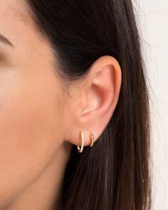 "A must-have essential in every jewelry collection - these dainty, medium-sized hoops are embedded with sparkly cubic zirconia gemstones and will go with everything. ∙ Sold individually (1 earring) or as a PAIR (2 earrings) * D E T A I L S * ∙ Material: .925 Sterling Silver or 18K Gold Plated over .925 Sterling Silver ∙ Stone: White Zirconia ∙ Dimensions:  Diameter: 15mm ∙ Hypoallergenic & nickel-free * P A C K A G I N G * ∙ All jewelry is sent out beautifully packaged in our signature box & ready for gifting. ∙ In order to reduce waste, we often put an order with multiple pieces in the same box. If one of the pieces is intended as a gift or if you would like each piece in its own box, just leave a note at checkout and we'll be happy to box separately. ∙ No Extra Shipping Cost for addition Double Ear Piercings, Double Earrings, Earrings Gold Hoop, Small Gold Hoop Earrings, Dainty Hoop Earrings, Small Gold Hoops, Tiny Hoop Earrings, Hoops Gold, Small Hoop Earrings