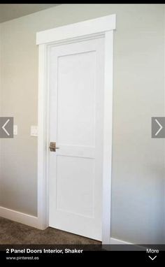 an empty room with white doors and carpeted flooring in front of the door