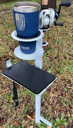 a blue and white bucket sitting on top of a table next to a bike tire