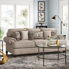 a living room scene with focus on the couch and coffee table in the center area