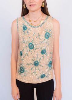 "Vintage 60s beaded hand-made top. This gorgeous top has so many sweet little details, including a blue beaded starburst-like design with iridescent clear sequins. 100% ivory virgin wool fabric. Boxy relaxed silhouette. Back metal zipper fastening. Fully lined. We kindly ask that you please view all measurements for comparison so you can get your desired fit. Quality-made heavy top. * Brand: Imperial Imports * Decade: 1960s * Fabric: 100% Virgin Wool, Glass Beads, Sequins * Lining: Nylon * Color 1960s Fabric, Beaded Top, Sequin Beading, Puff Sleeve Top, Boho Blouses, Metal Zipper, Blouse Vintage, Wool Fabric, Vintage 60s