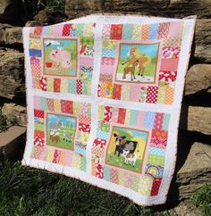 a patchwork quilt with farm animals on it