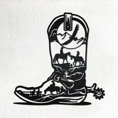 a cowboy boot with horses and birds on it is cut out from the silhouettes