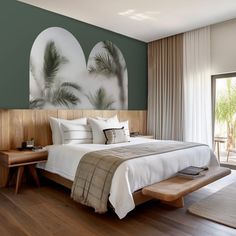 a bed sitting in a bedroom on top of a hard wood floor next to a window