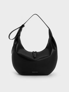 This product is made with at least 20% sustainable materials by weight. CHARLES & KEITH uses recycled, degradable, organic, and water-based materials in our eco-conscious collection.An effortlessly stylish everyday bag is a wardrobe staple for any season, and the Odella hobo bag definitely ticks all the boxes for that. Featuring a clean, crescent silhouette in sleek black, this carrier will be a sophisticated companion for any occasion. The slouchy shape gives it a relaxed feel, which makes it i Casual Neutral Outfits, Charles And Keith Bags, Charles And Keith, Latest Bags, Size Chart For Kids, Charts For Kids, Charles Keith, Wallet Accessories, Printables Kids