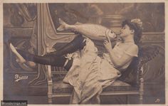 an old photo of a woman sitting on a chair with a fish in her mouth