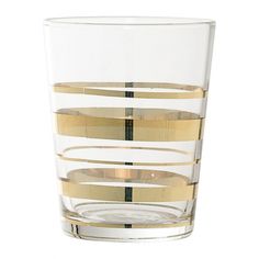 a clear glass with gold strips on the rim