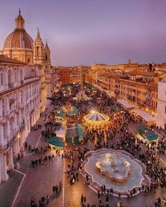 an aerial view of a city square at dusk