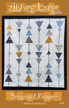 an image of a quilt with triangles on it