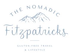 the nomadic fitzspatricks logo on a white background with blue lettering