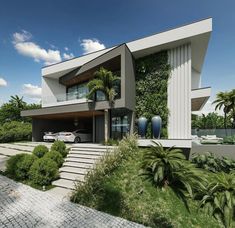 a large modern house with lots of greenery on the side