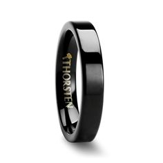 a black ring with gold lettering on the inside and inlaid to it, is shown