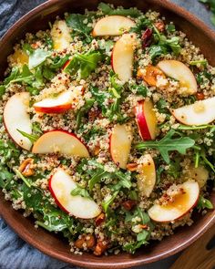 a salad with apples and quinoa in a bowl