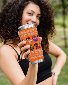 a woman holding up a cup with the words you are my on it